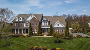 Reddish Brown Brick Luxury House with a Clean Yard Landscape